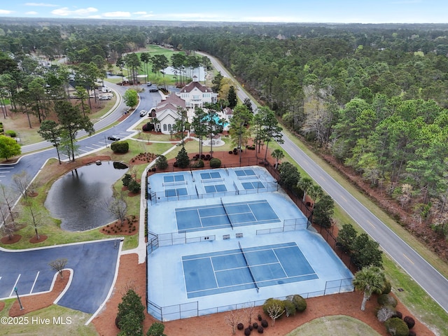 bird's eye view featuring a wooded view
