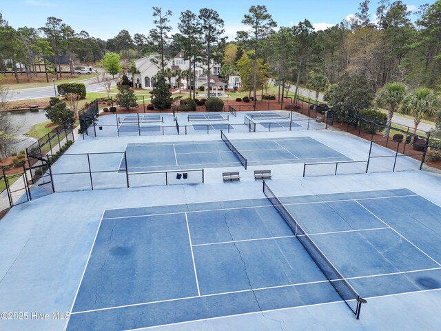 view of sport court with fence