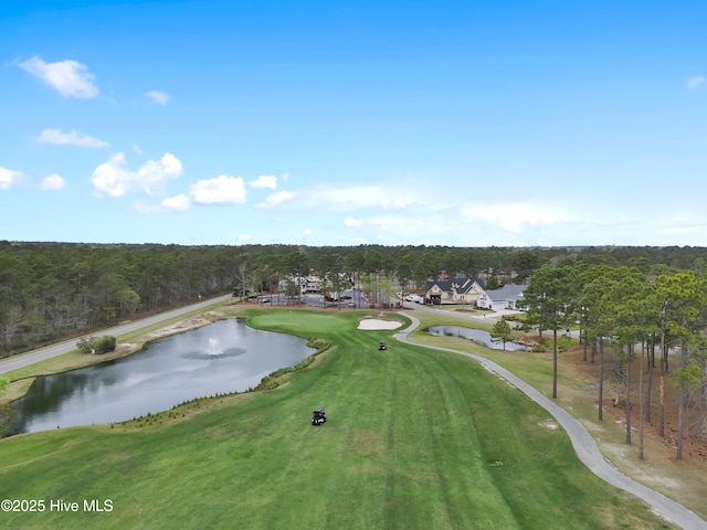 bird's eye view with view of golf course and a water view