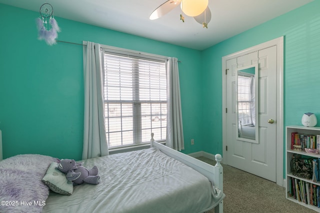 bedroom with multiple windows and a ceiling fan