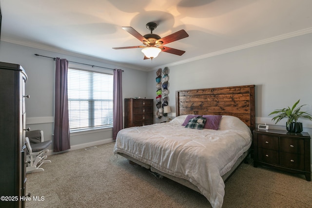 carpeted bedroom with crown molding, a ceiling fan, and baseboards