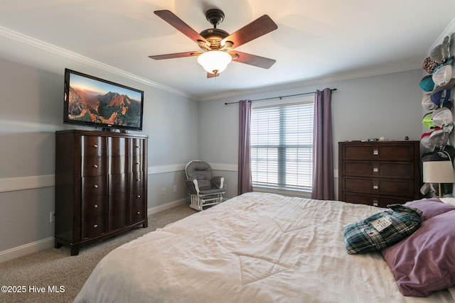 bedroom with ornamental molding, a ceiling fan, baseboards, and carpet floors