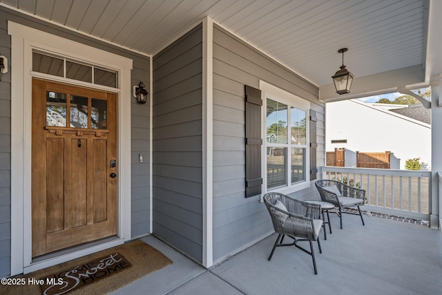 entrance to property featuring covered porch