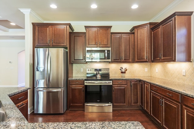 kitchen featuring tasteful backsplash, crown molding, dark wood-type flooring, stone countertops, and stainless steel appliances