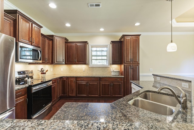 kitchen with visible vents, ornamental molding, a sink, appliances with stainless steel finishes, and backsplash