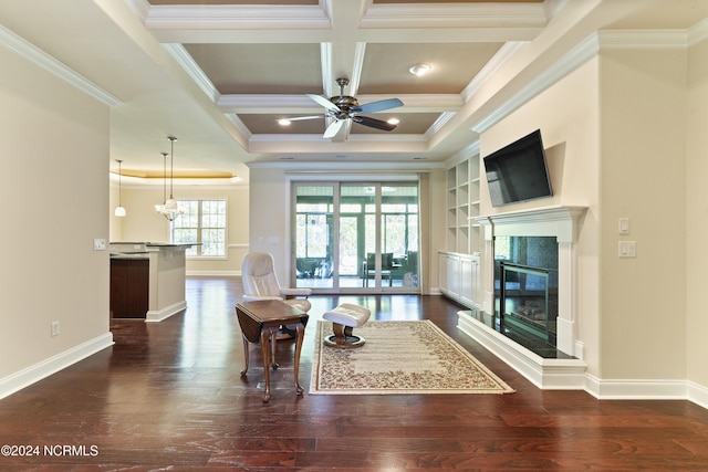 living room with wood finished floors, baseboards, and coffered ceiling