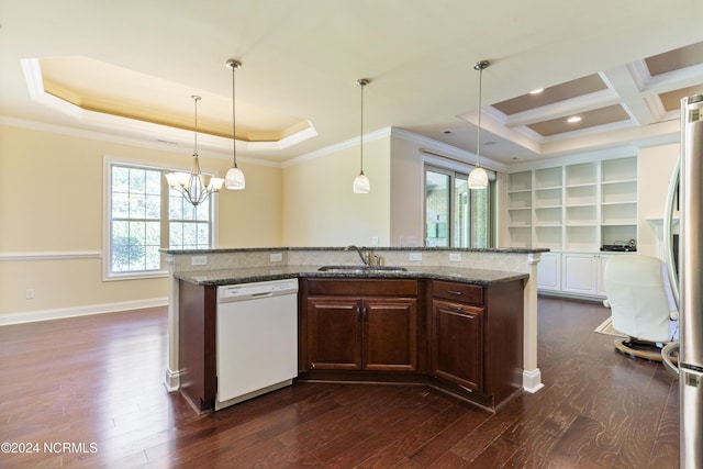 kitchen with dark wood finished floors, a chandelier, dishwasher, a tray ceiling, and a sink