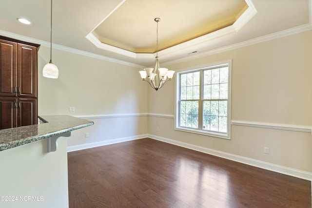 unfurnished dining area with a raised ceiling, an inviting chandelier, and dark wood-style floors