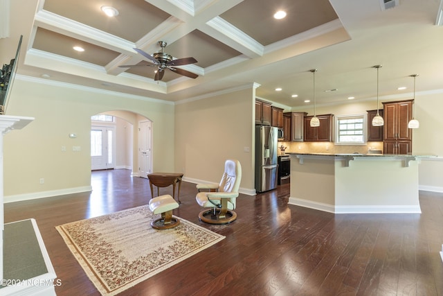 interior space featuring arched walkways, stainless steel fridge, a breakfast bar, and dark wood-type flooring