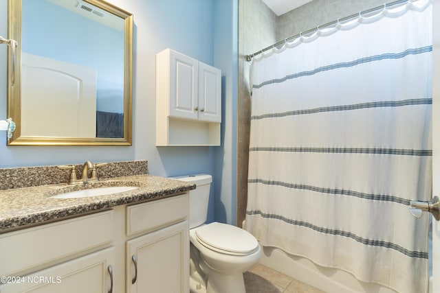 full bathroom with visible vents, toilet, shower / tub combo with curtain, tile patterned floors, and vanity