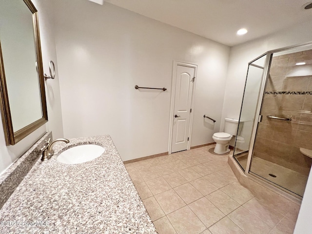 full bath with tile patterned flooring, a shower stall, baseboards, toilet, and vanity