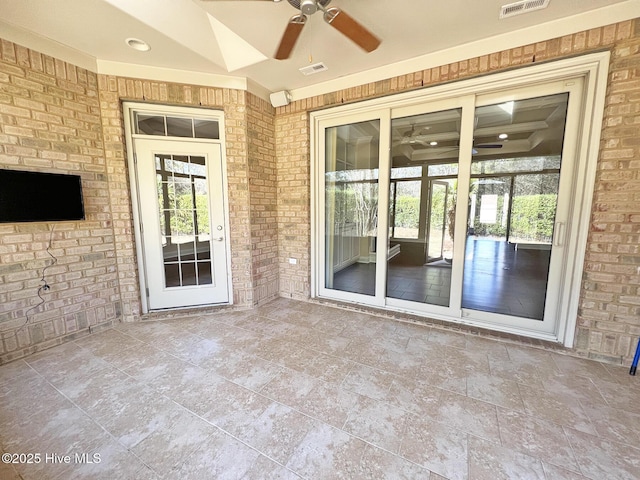 view of patio featuring visible vents and ceiling fan