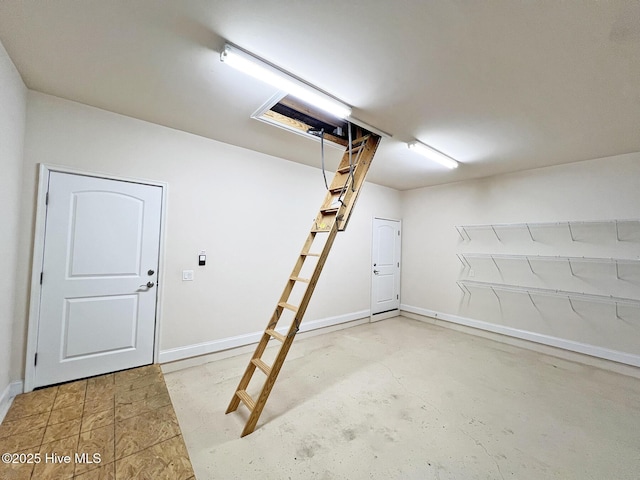 garage featuring baseboards