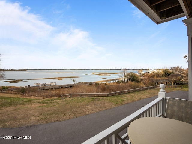 balcony featuring a water view