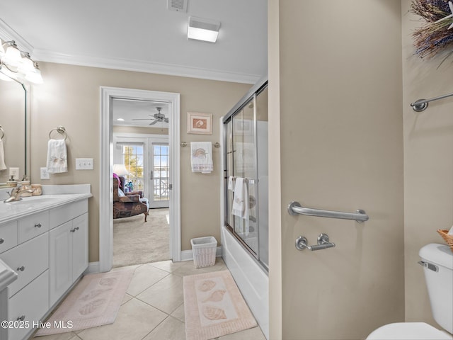 full bathroom featuring toilet, shower / bath combination with glass door, vanity, ornamental molding, and tile patterned floors