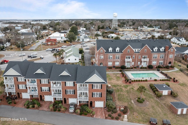 birds eye view of property with a residential view