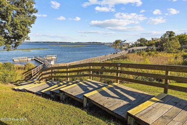 exterior space featuring a boat dock and a water view