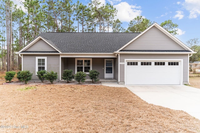 ranch-style home with a porch, roof with shingles, concrete driveway, and an attached garage