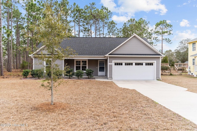 ranch-style home with a shingled roof, concrete driveway, a front yard, covered porch, and a garage