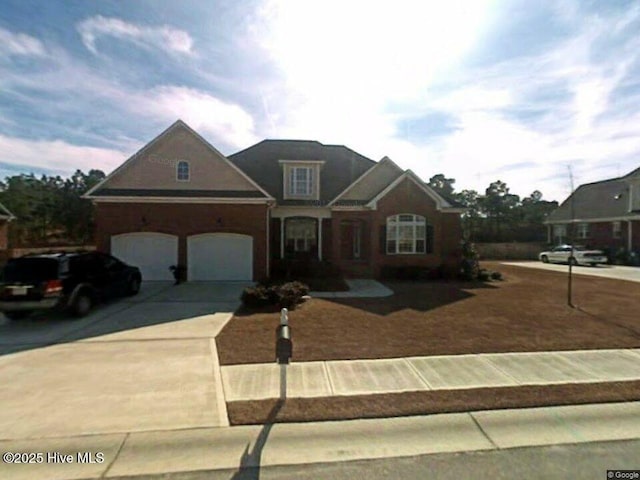 traditional-style house with concrete driveway and an attached garage