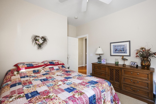 bedroom with a ceiling fan and baseboards