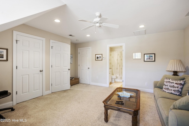 carpeted living area featuring baseboards, ceiling fan, visible vents, and recessed lighting