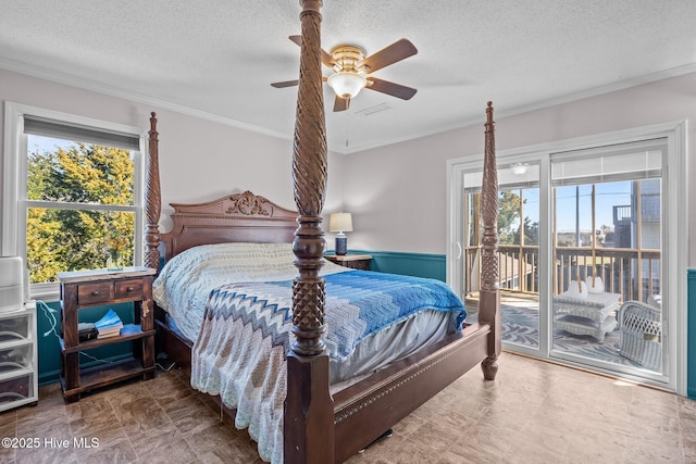 bedroom with access to exterior, multiple windows, ornamental molding, and a textured ceiling