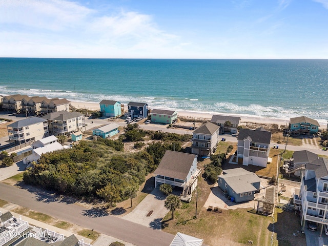 bird's eye view with a beach view, a residential view, and a water view