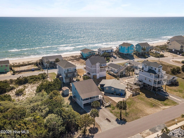 aerial view with a view of the beach, a residential view, and a water view