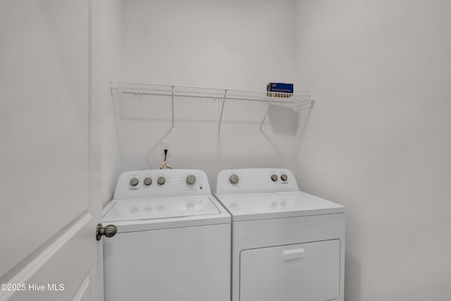 laundry area featuring laundry area and separate washer and dryer