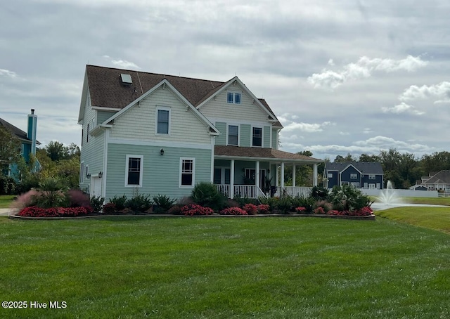 view of front of property featuring a porch and a front yard