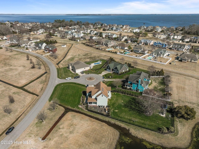 birds eye view of property featuring a residential view and a water view