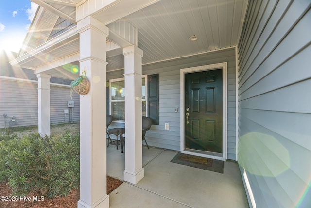 doorway to property with a porch