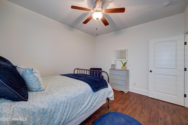 bedroom featuring ceiling fan, wood finished floors, and baseboards