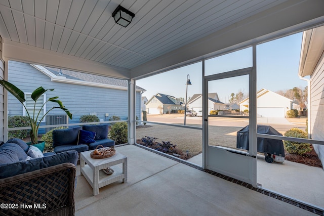 sunroom / solarium with a residential view