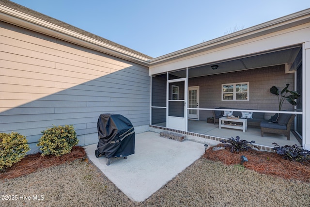 view of patio / terrace with an outdoor hangout area, a grill, and a sunroom