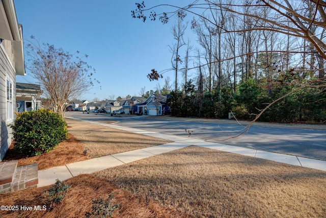 view of street with a residential view and sidewalks