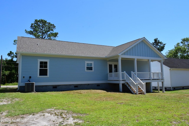 back of house with a porch, crawl space, a yard, and central air condition unit