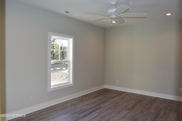 empty room featuring a ceiling fan, baseboards, dark wood-style flooring, and recessed lighting