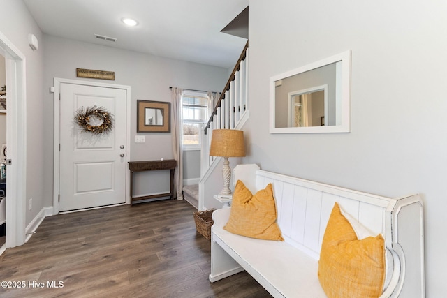 entryway with recessed lighting, visible vents, stairway, wood finished floors, and baseboards