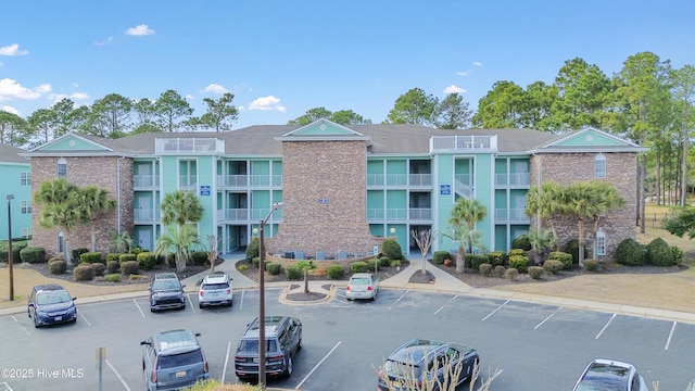 view of property with uncovered parking