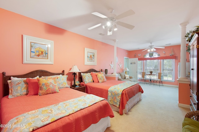 carpeted bedroom with a ceiling fan, decorative columns, and baseboards