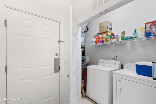 clothes washing area with laundry area and washing machine and clothes dryer