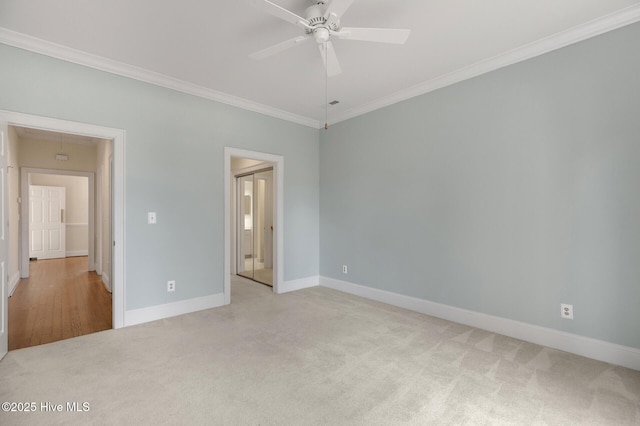 unfurnished bedroom with baseboards, carpet floors, attic access, and crown molding