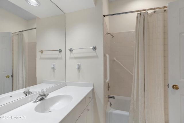 full bath with vanity and shower / bathtub combination with curtain