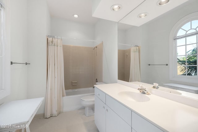 full bath featuring recessed lighting, vanity, toilet, and shower / tub combo with curtain