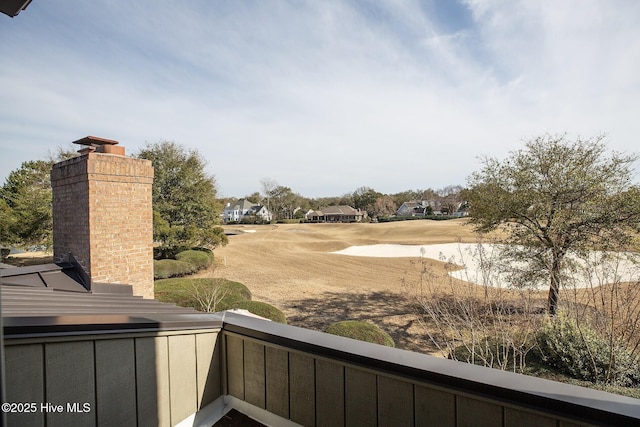 view of yard with a balcony