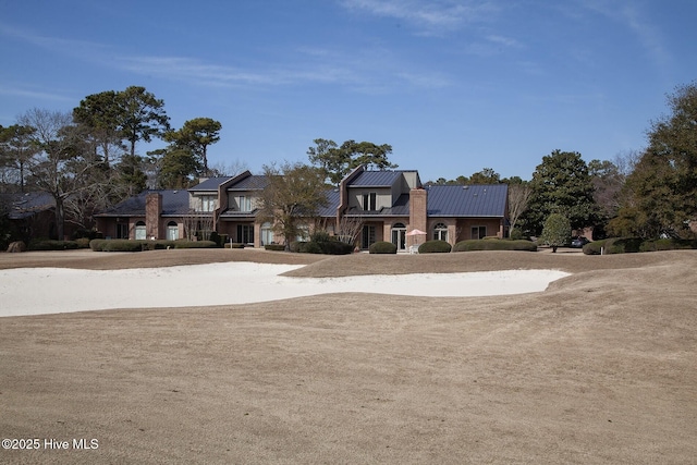 view of front of house with a standing seam roof and metal roof