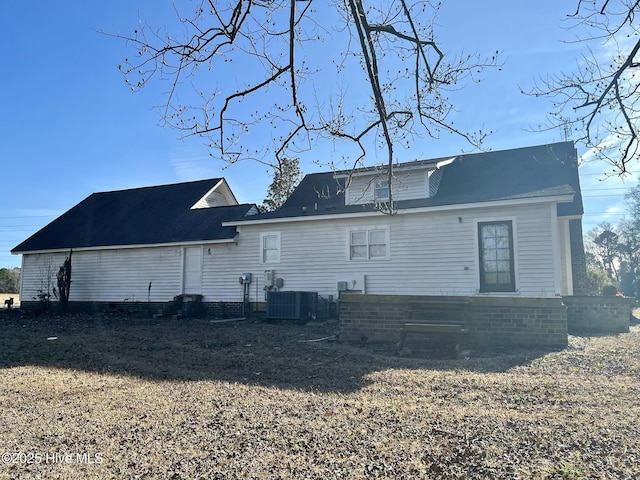 rear view of house with central AC