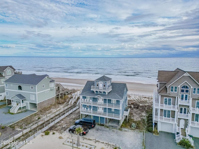 aerial view with a water view and a view of the beach